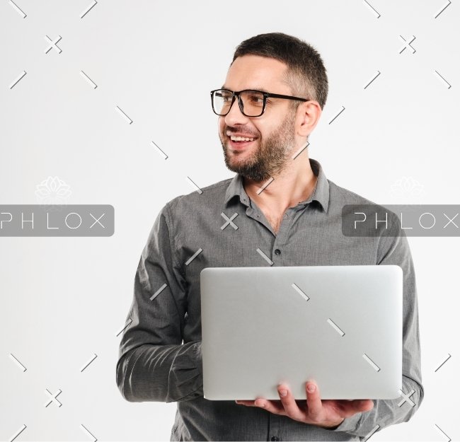 concentrated-businessman-using-laptop-computer-PE3ARHB